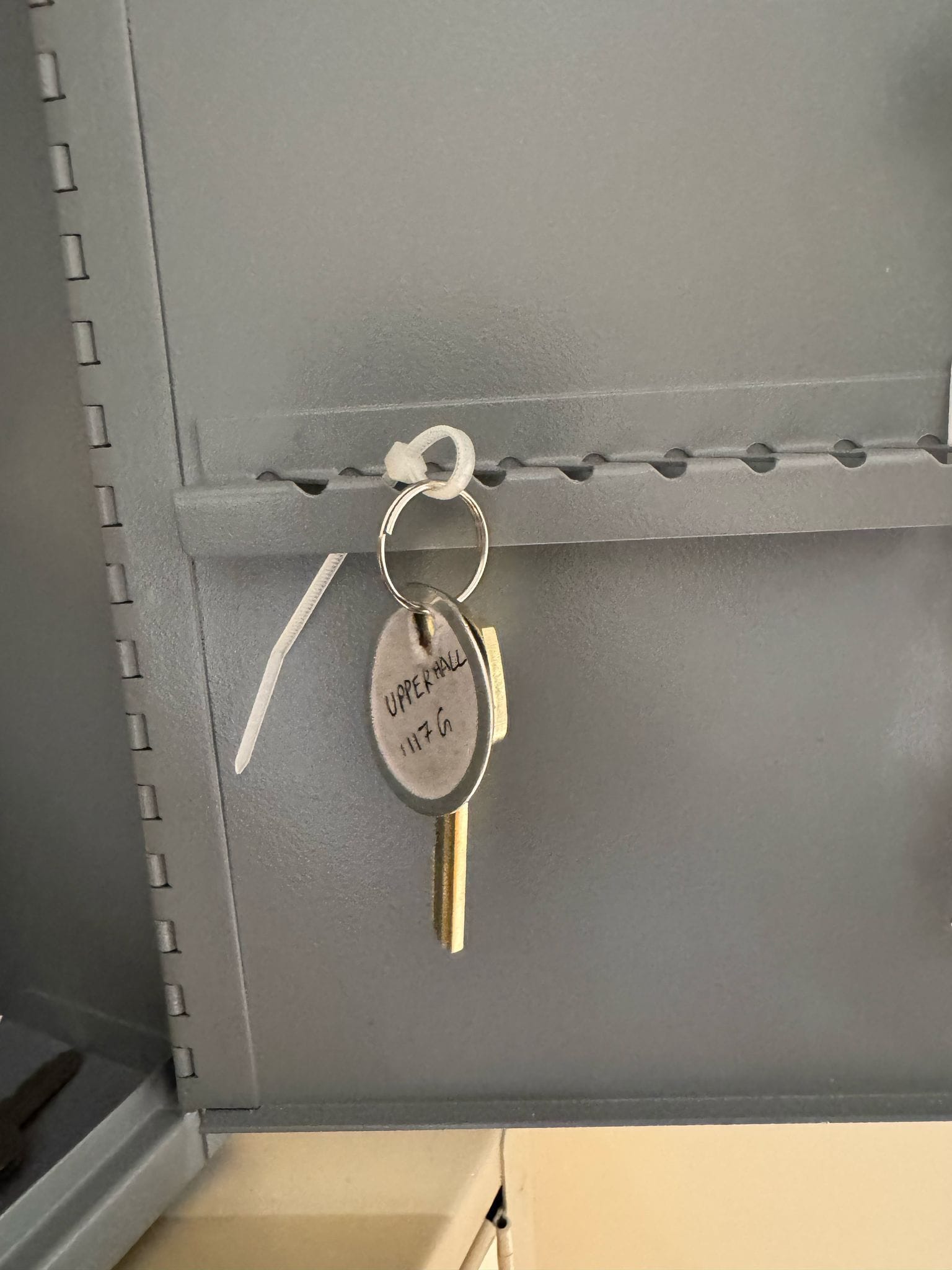 Commercial cabinet key tagged and secured after rekey service by Costa Locksmith in Columbus, Ohio